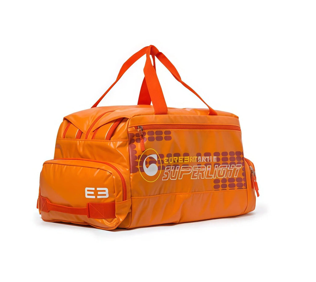 Bright orange Cerebro Superlight golf duffel bag with twin grab handles, end shoe compartment and printed Superlight graphic
