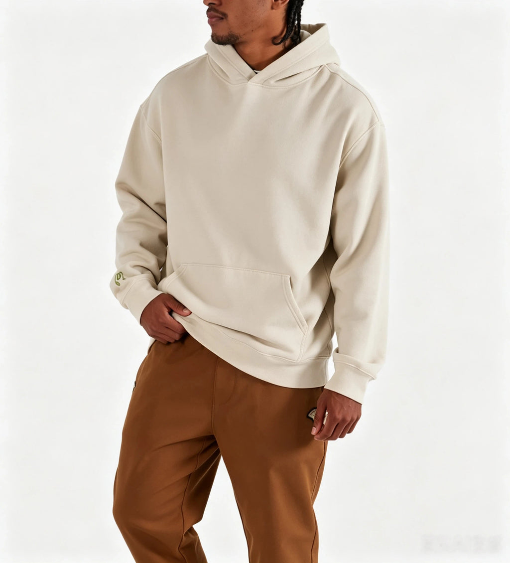 Model wearing Malbon beige heavyweight hoodie front view