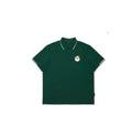 Malbon men's summer breathable golf polo in green with white collar tipping and embroidered chest patch