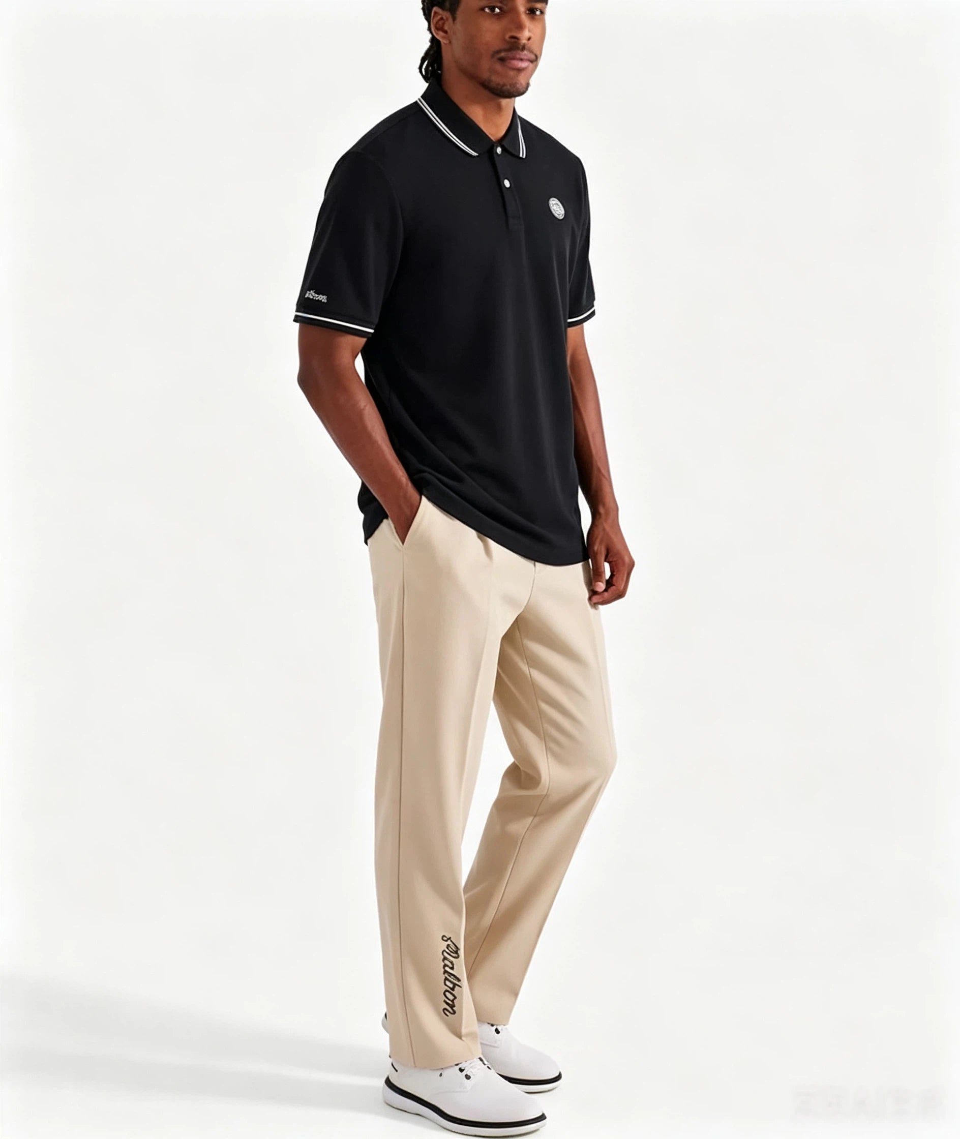 Malbon men's moisture-wicking athletic golf polo in Black - model front view