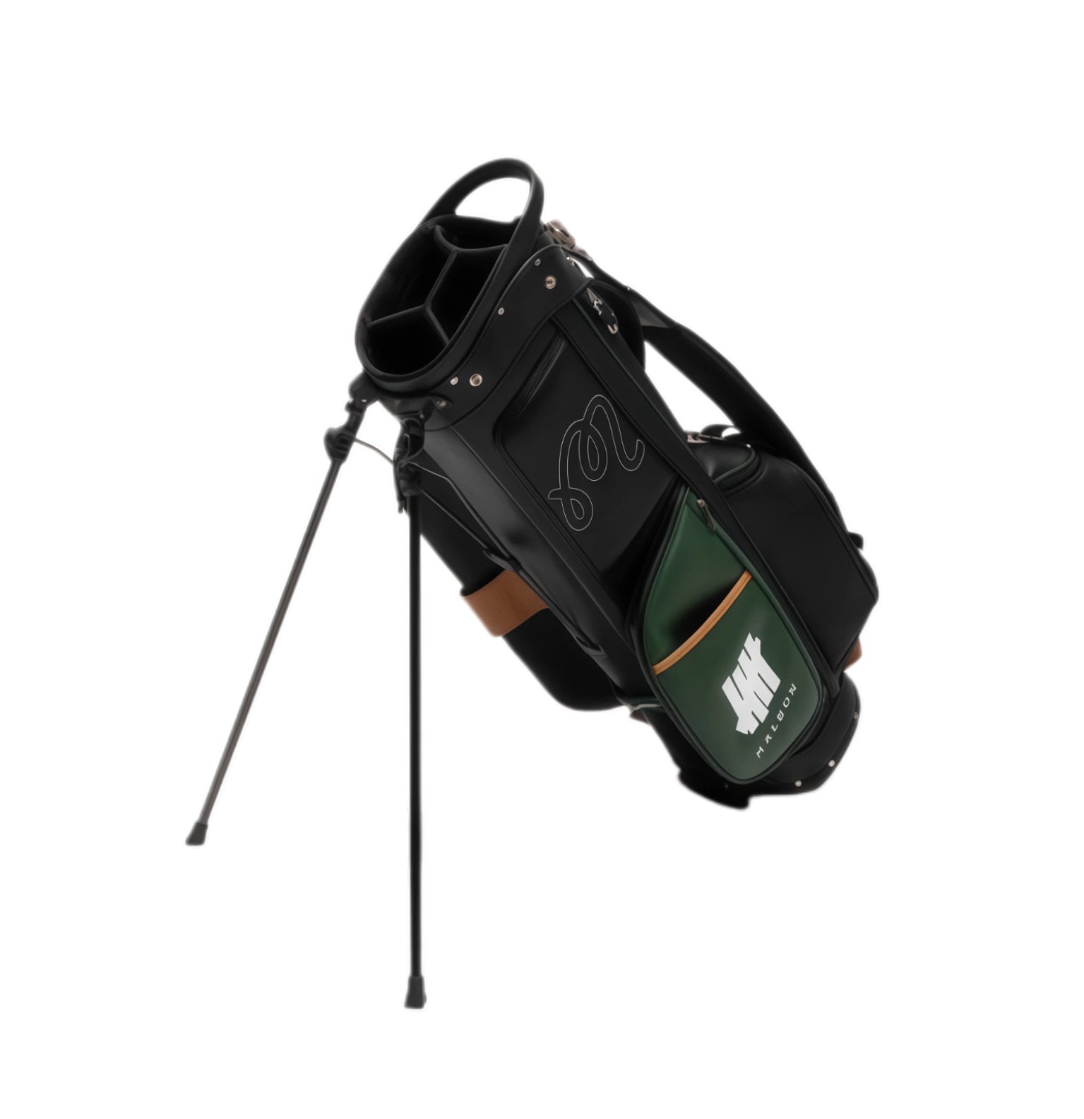 Angled shot of Malbon Golf stand bag with deployed black dual-leg stand system, highlighting lightweight structure, top carry handle, and sleek black/green color blocking design.