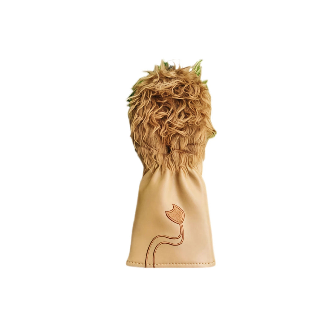 Rear view of a lion golf headcover highlighting the stitched tail detail on the tan PU fabric, with curly faux fur mane visible at the top and green leaf accents.