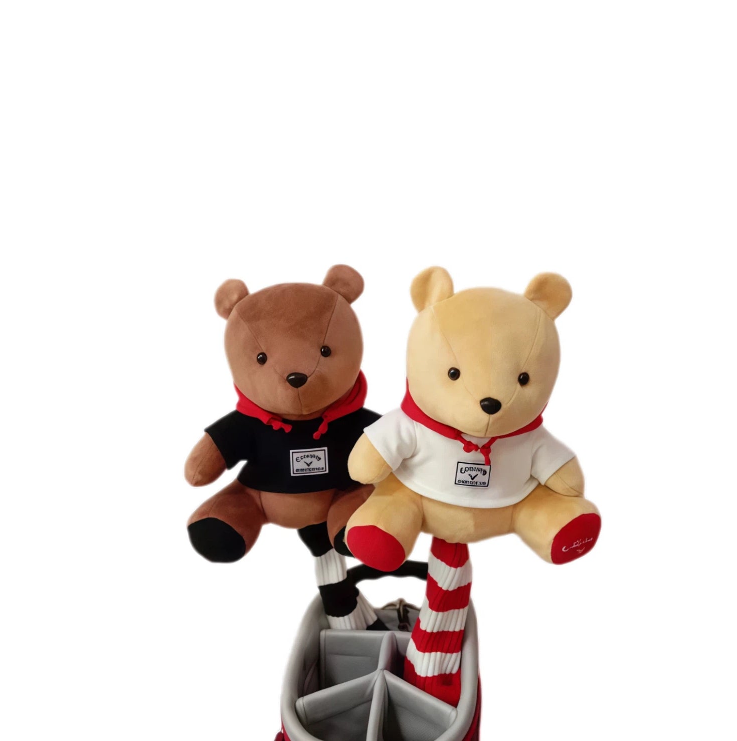 Two teddy bears, one brown and one beige, wearing outfits with visible logos on a white background.