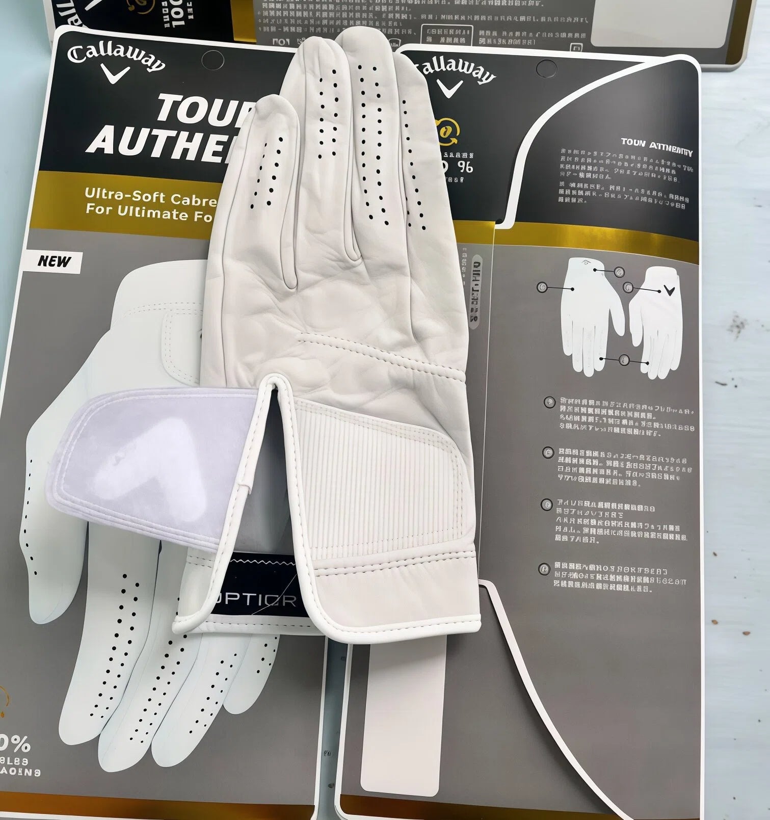 Callaway Tour Authentic golf glove packaging showing the 2025 new model label, highlighting the ultra-soft Cabretta leather material and adjustable velcro closure system.