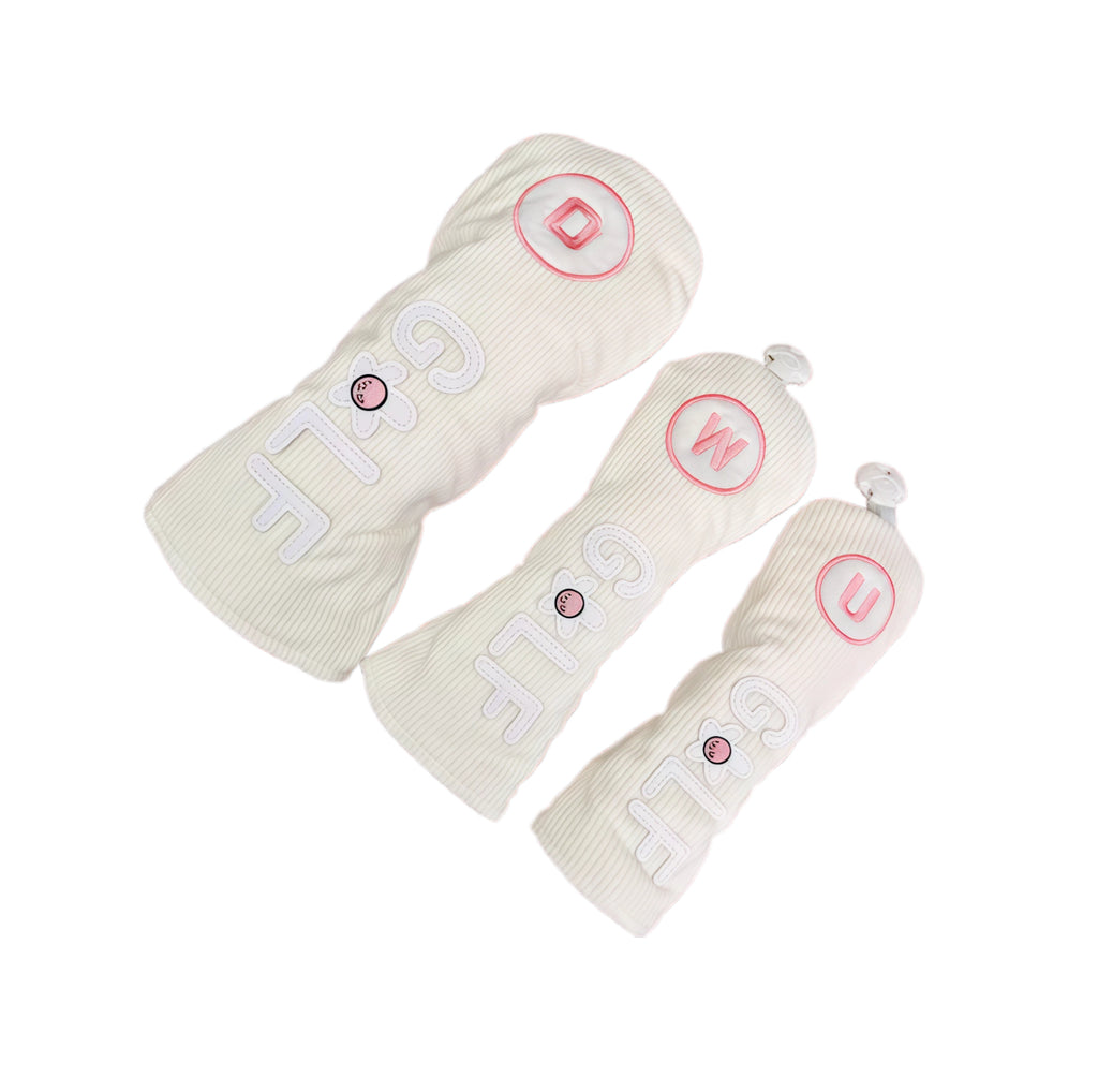 Side view of corduroy golf headcovers set showing shaft insertion and white corduroy texture with pink lettering, offering secure fit and stylish protection.