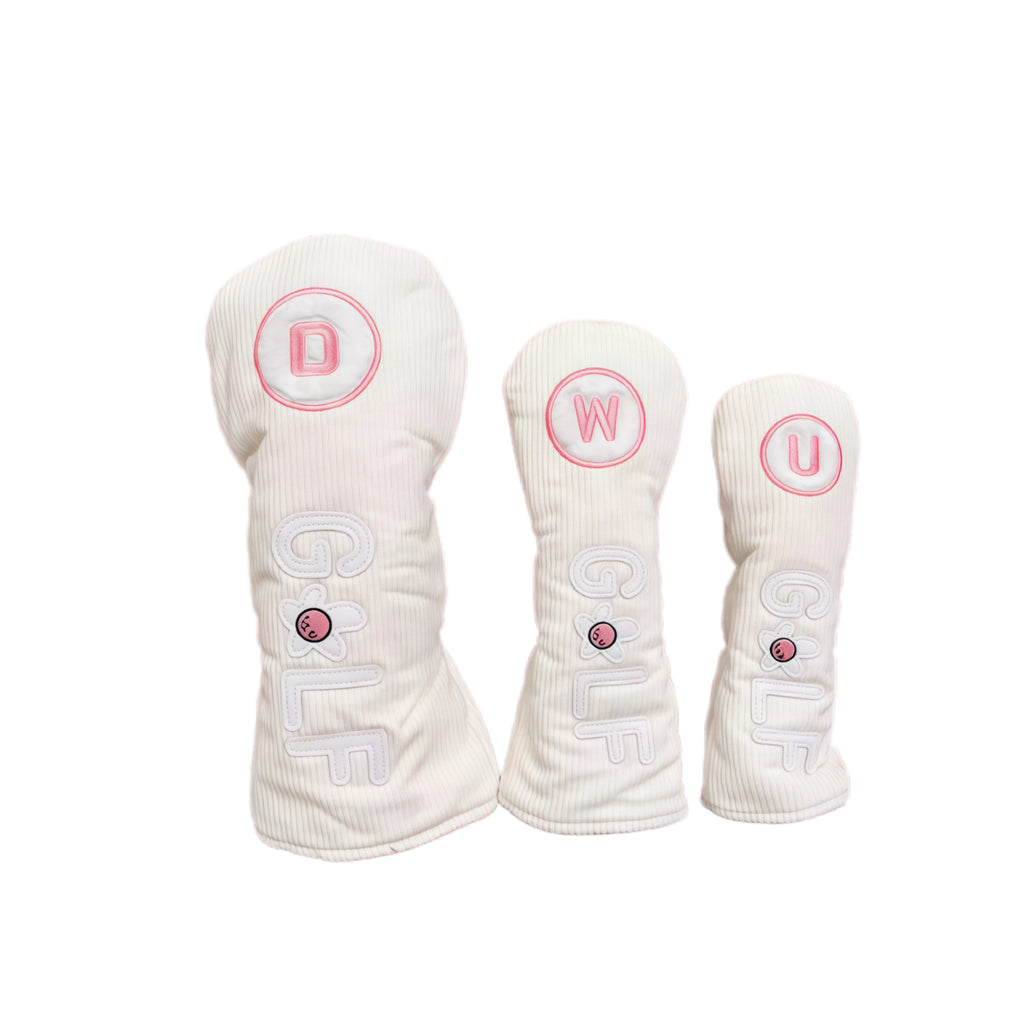 White corduroy golf headcovers set with pink flower accents and立体GOLF letters, designed for driver, fairway and utility clubs with durable protection.