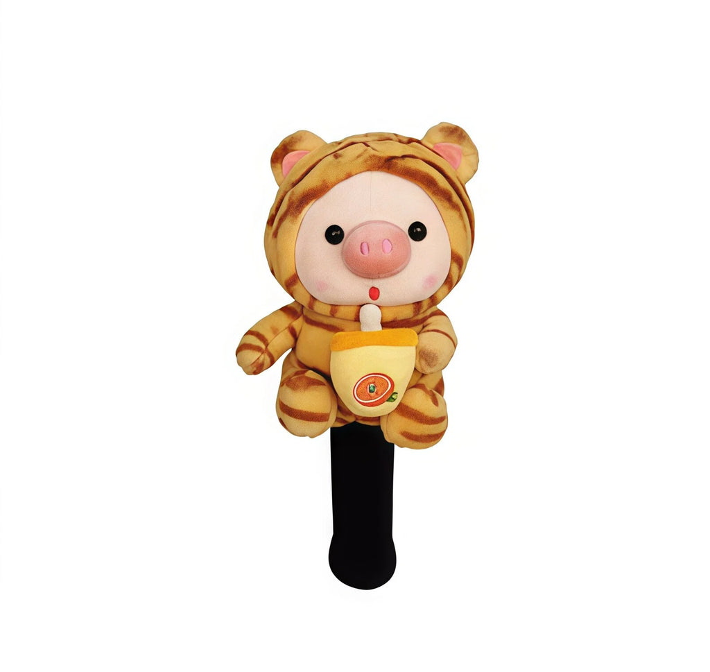 Front view of a plush golf headcover featuring a cute pink pig wearing an orange tiger-striped costume, holding a cup with an orange slice design, perfect for driver or fairway wood protection.