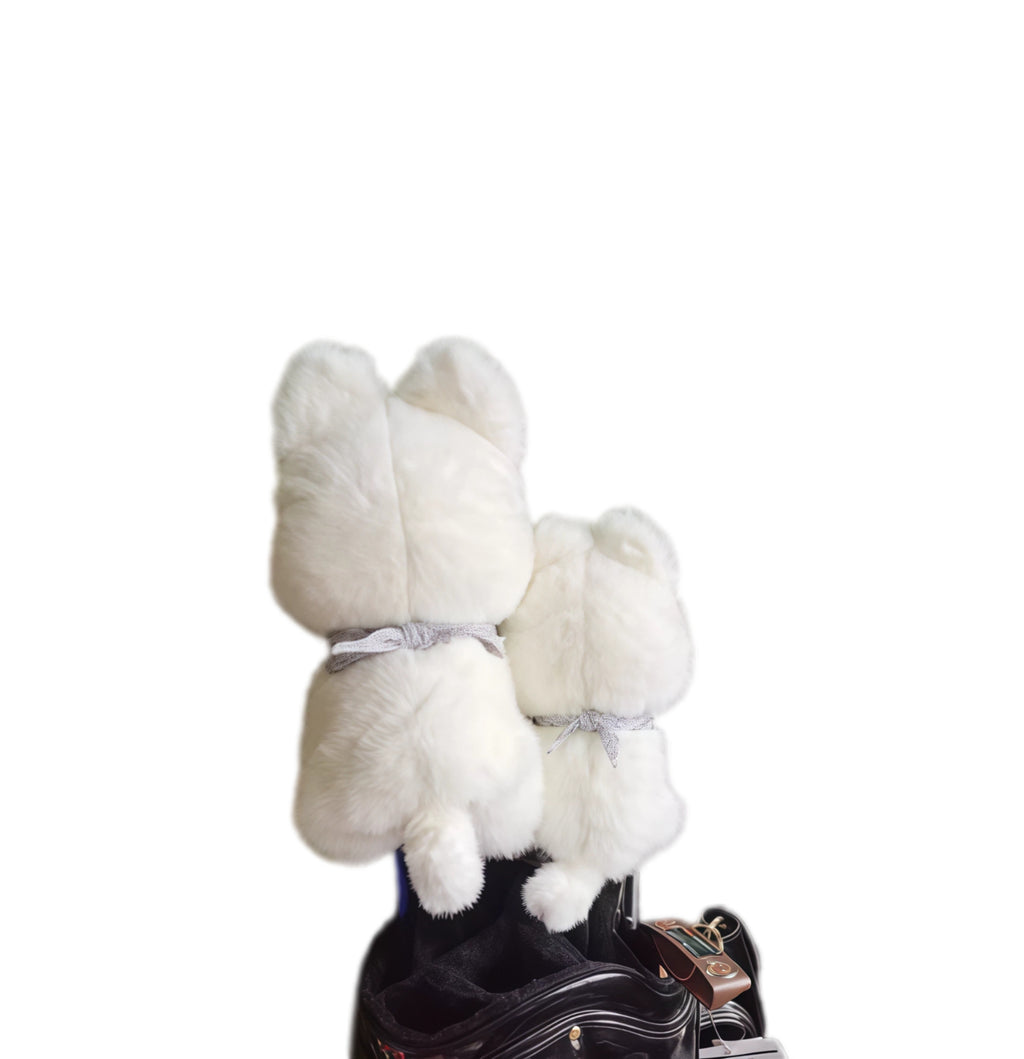 Back view of cute Westie golf headcovers set showing bow detail and plush white material, designed for secure fit and protection on golf clubs.