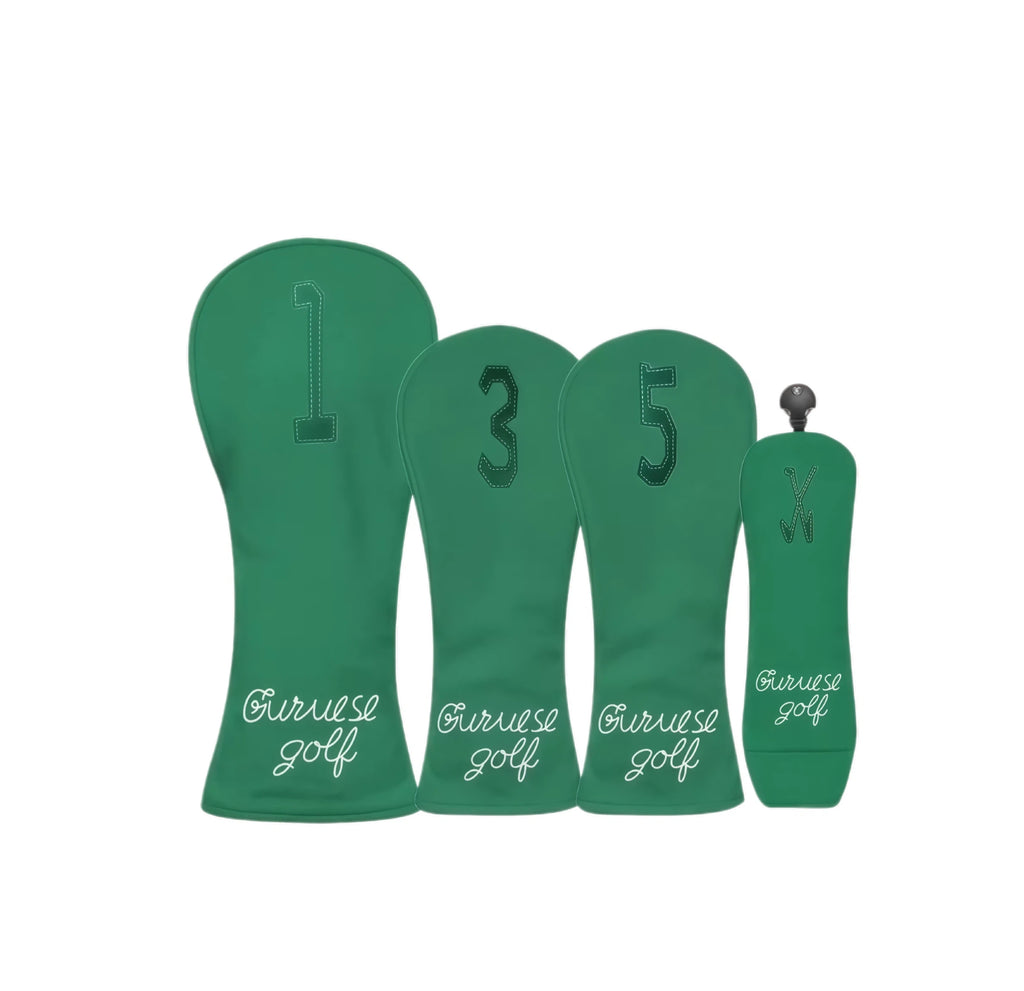 Forest green Guruese Golf headcover set with tonal dark-green stitched numbers (#1, #3, #5, X) and crisp white script logo; includes full wood/hybrid coverage with sleek minimalist design for modern golfers.