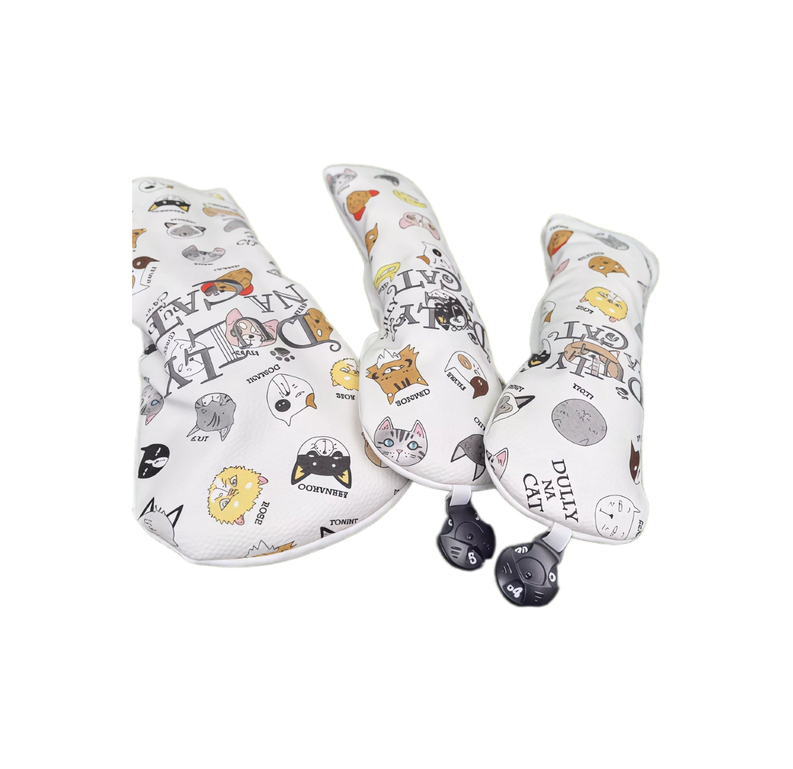 Side view of Lazy Cat golf headcovers set displaying cat face patterns and DULLY NA CAT logo, compatible with driver, fairway and utility clubs.
