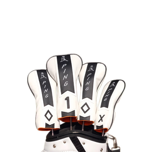 Set of limited edition Masters Pin golf headcovers by PING, featuring white leather with black stripes, orange accents, and iconic PING branding, designed to protect your driver and fairway woods with a premium and tournament-inspired look.