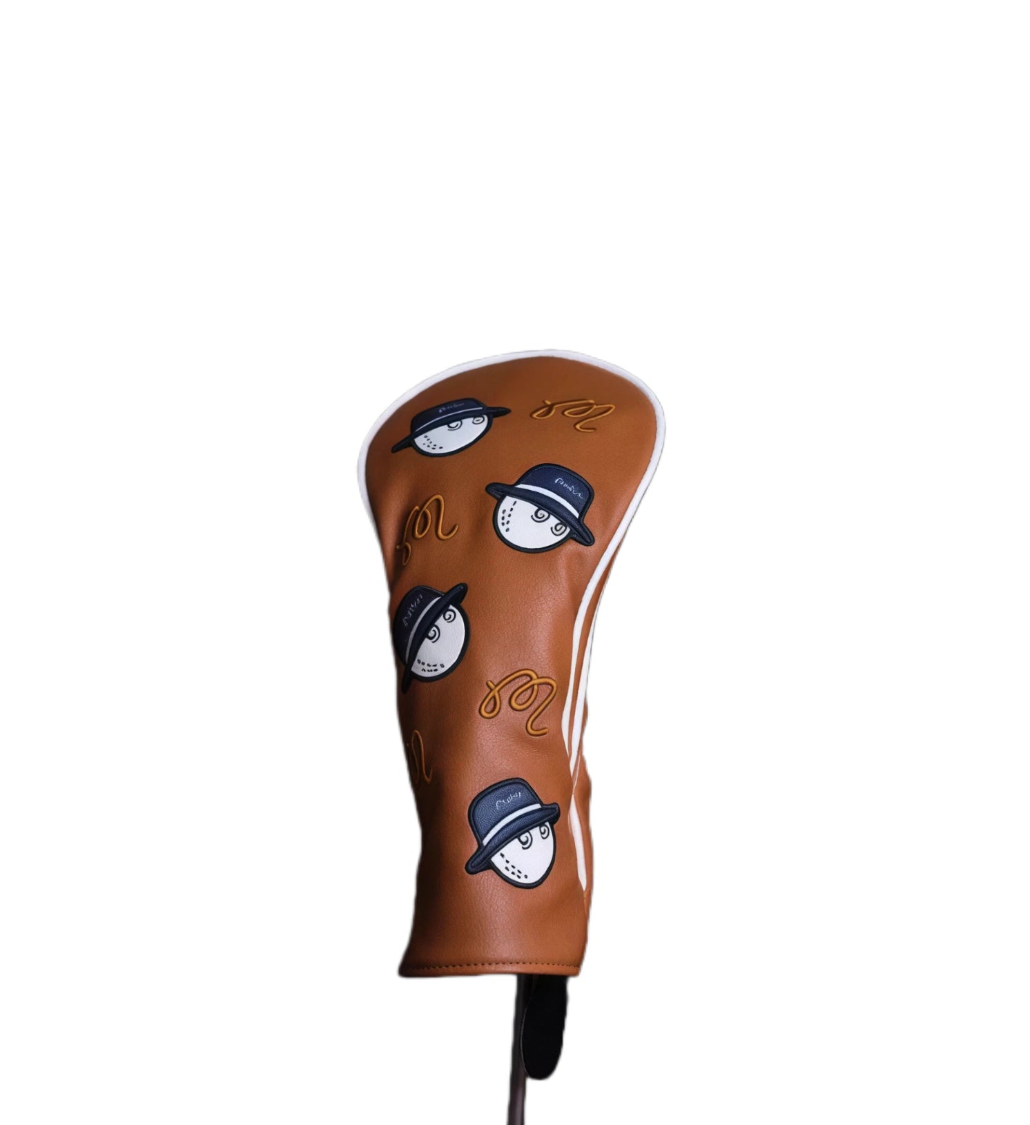 Close-up of a Malbon Bucket Hat Driver Headcover in brown, showcasing the 3D embroidered golf ball character with a hat, white piping, and textured leather finish for golf club protection.