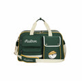 Side-angle view of open green Malbon golf duffle bag showing deep interior space, internal zippered pocket, and brand tag stitched inside