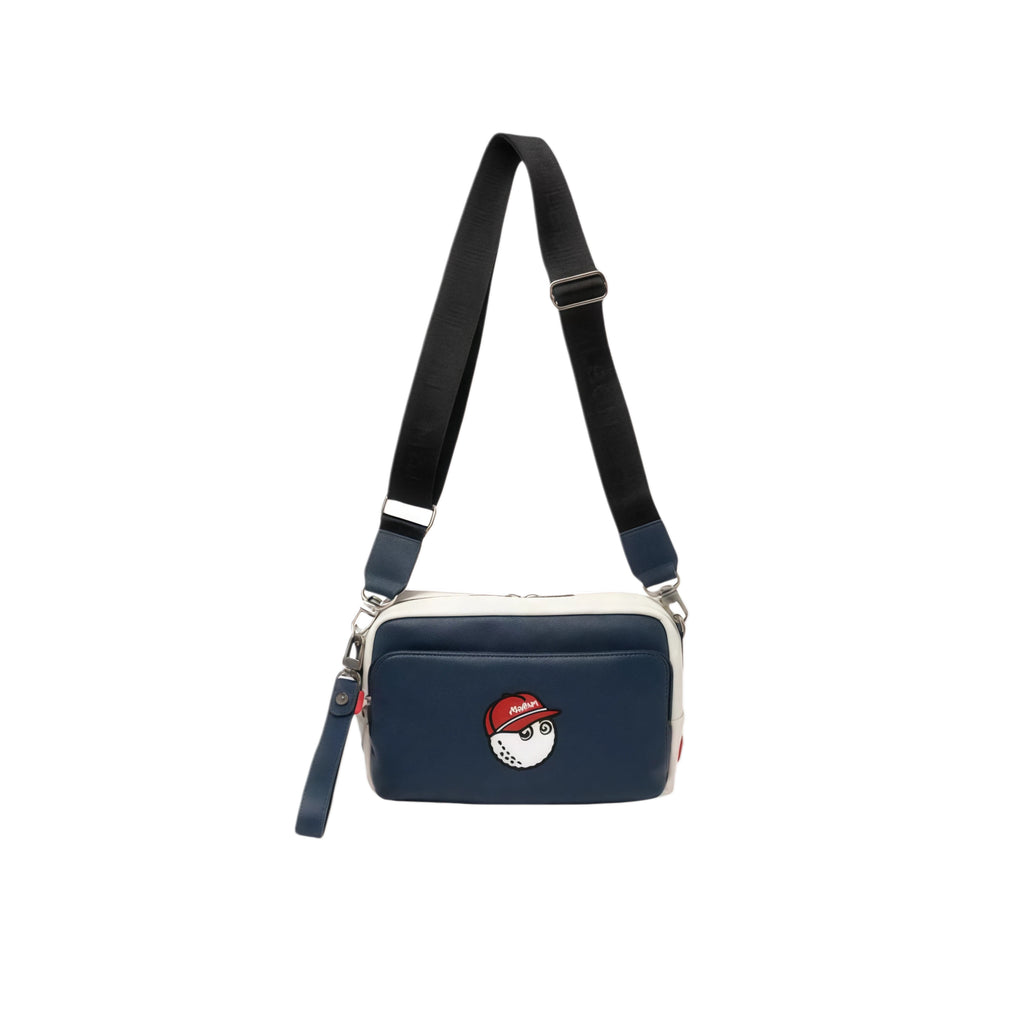 Side view of the navy blue Malbon performance crossbody bag showing full-length adjustable strap and secure metal clasps. Ideal for hands-free golfing or daily use.