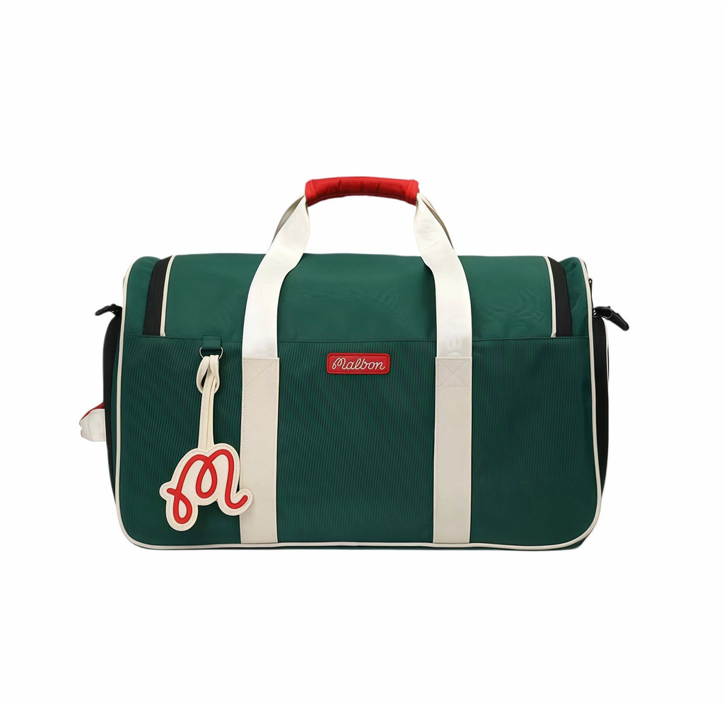 Front view of Malbon Golf Performance duffel bag in deep green featuring white straps, red top handle, red "M" tag charm, and red brand patch