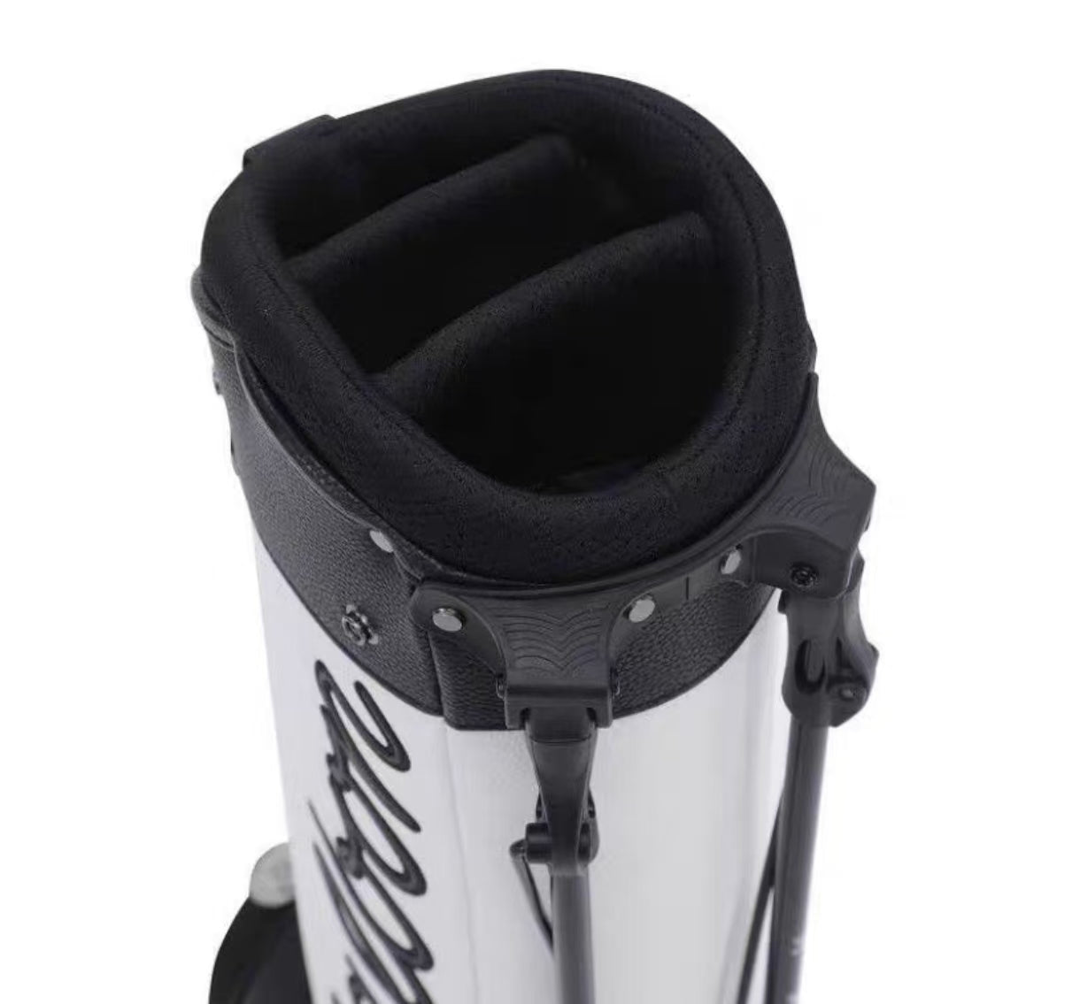 Close-up of a white and black golf bag with a visible brand logo on a white background