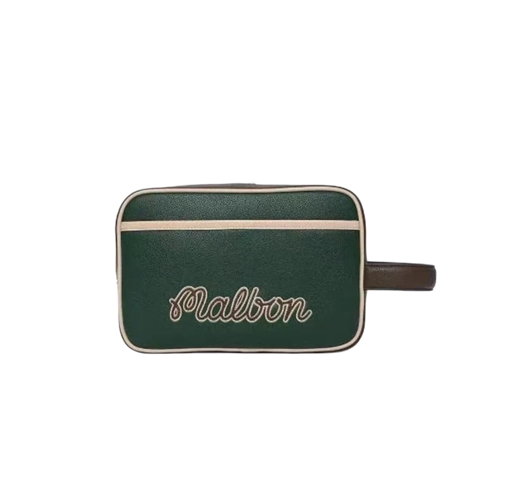 Front shot of the Malbon clubhouse tote in black with cursive embroidered "Malbon" logo. Premium craftsmanship and retro golf aesthetic.