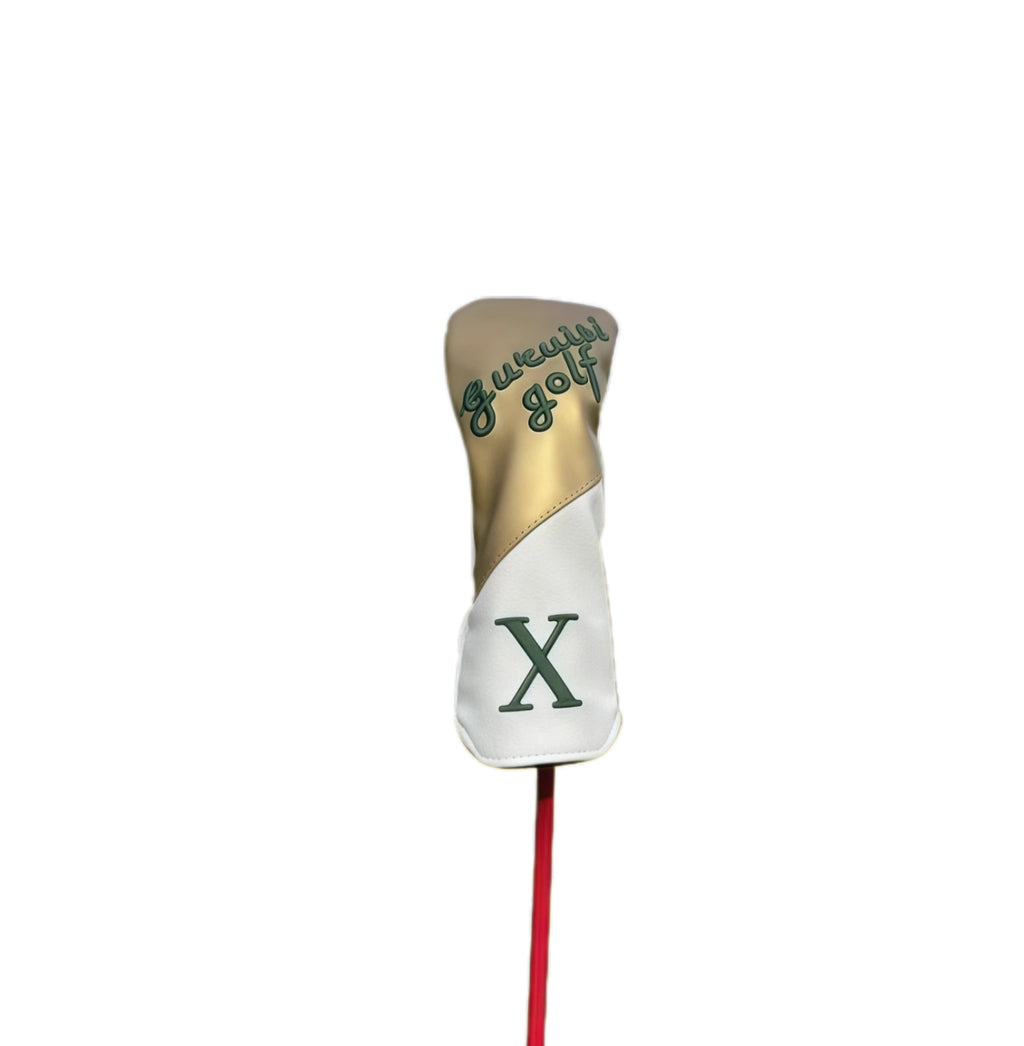 Golf club head cover with gold and white design on a white background