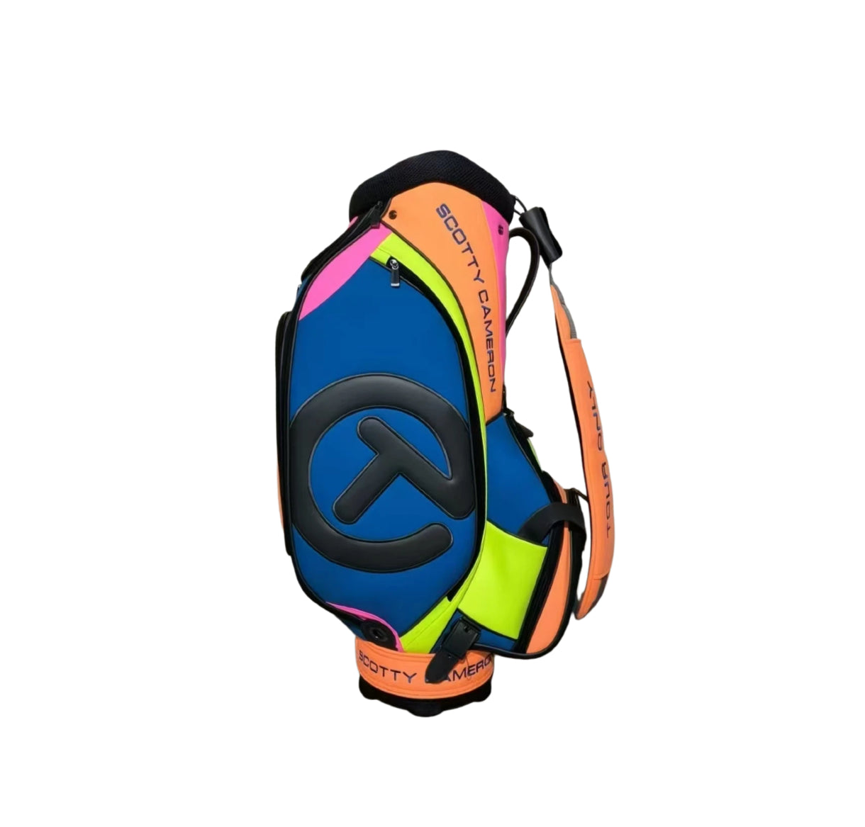 Angled view of the Scotty Cameron 2023 Tour Bag, displaying its multi-color design with blue, orange, pink, and neon yellow panels. The large black Circle T logo is prominently featured on the side.