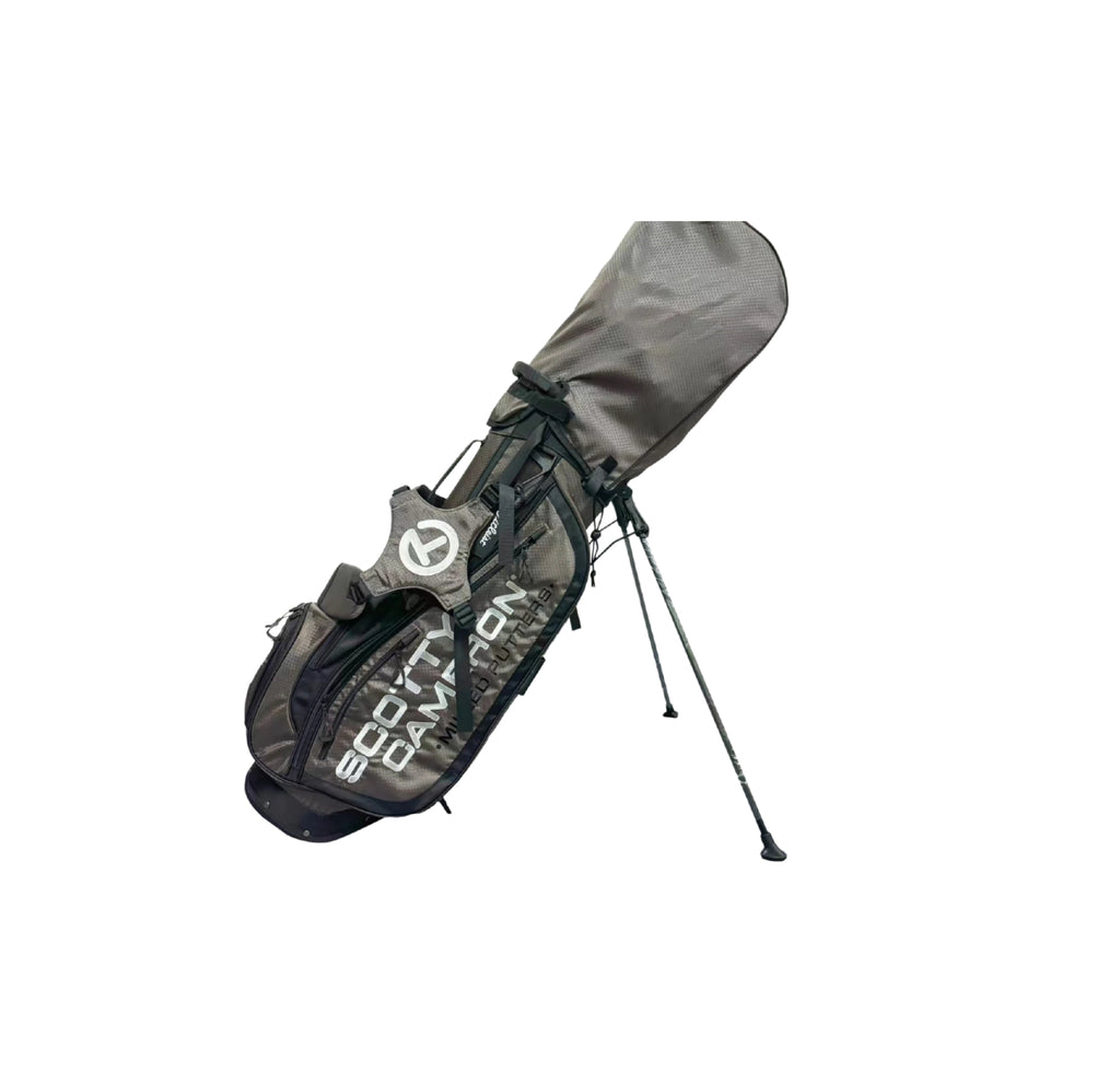 Side view of the Scotty Cameron Pathfinder Mainstay Charcoal Stand Bag with its stand legs extended. The bag showcases the detailed gray fabric, black accents, and the prominent Circle T logo on the side pocket.
