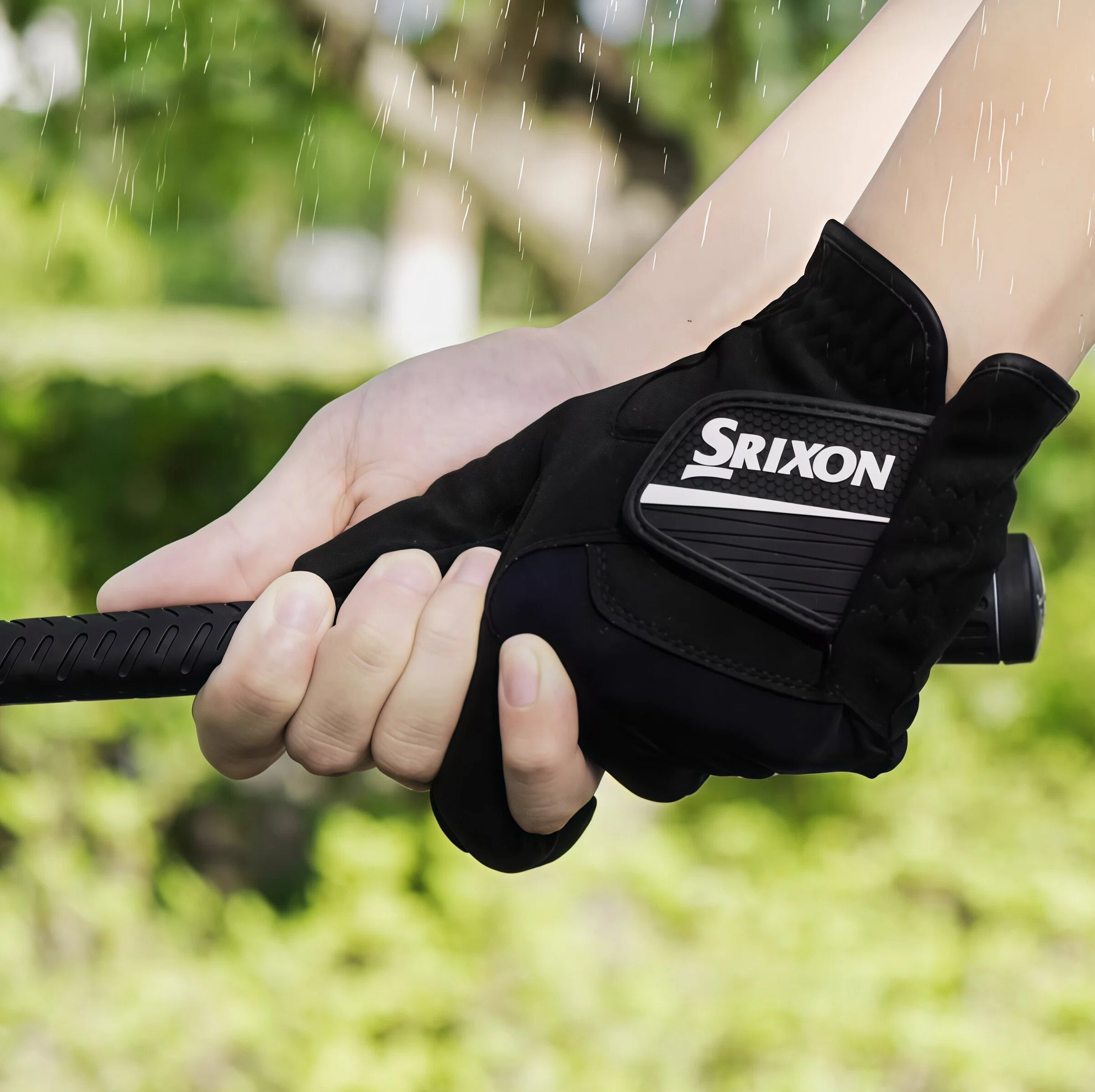 Srixon men's rain golf glove in black, featuring moisture-wicking material and all-weather grip for left-hand use during wet conditions.