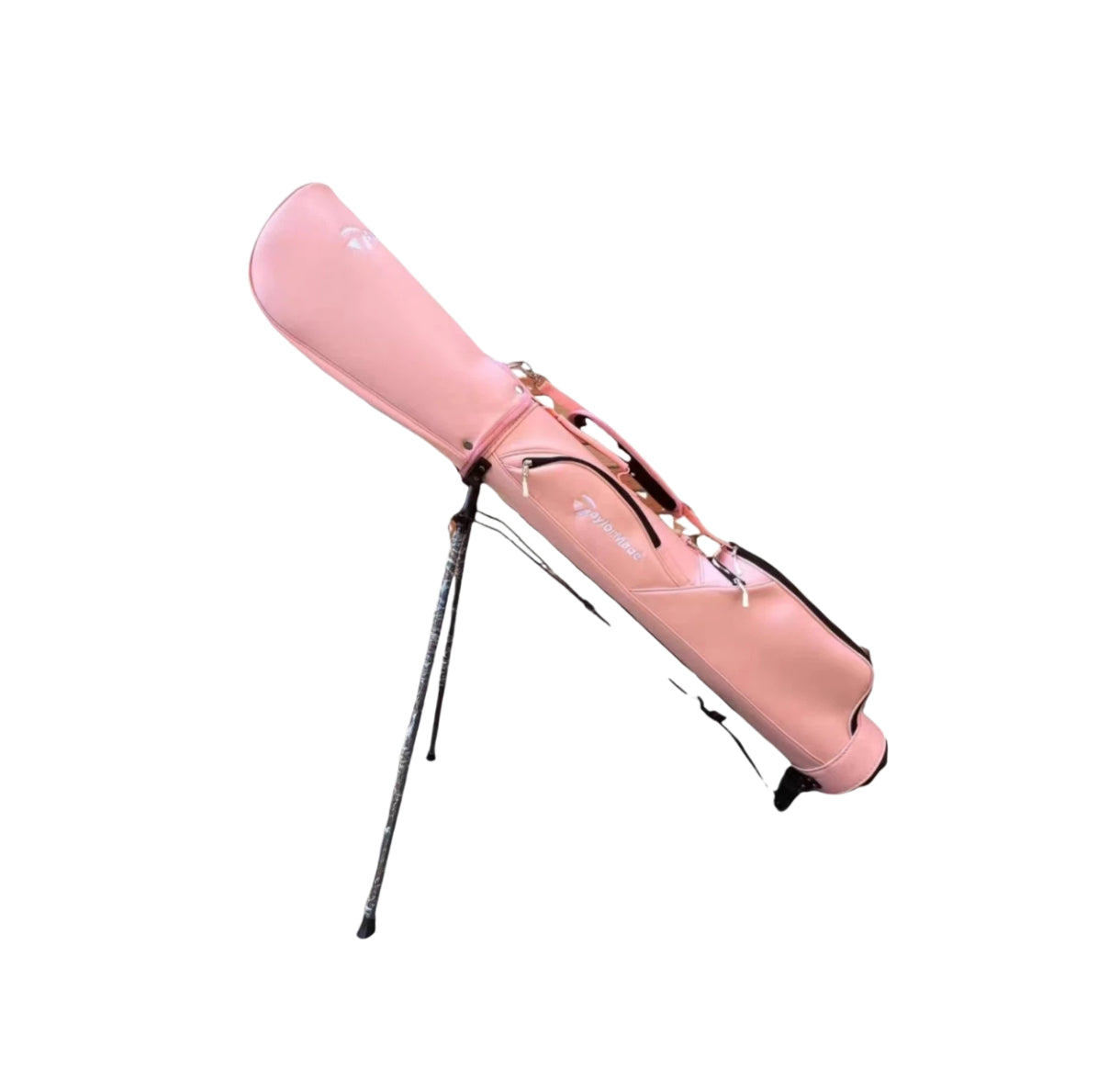 Side-angle view of the pink TaylorMade stand golf bag with fully opened stand legs. Shows compact build, lightweight construction, and multiple storage compartments for golf accessories and personal items.