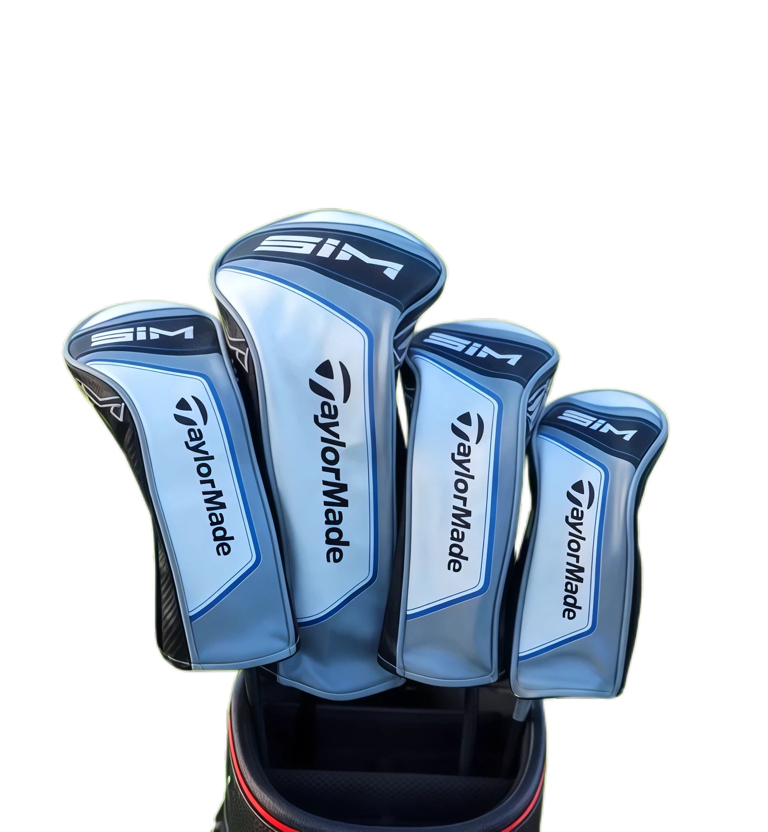 TaylorMade SIM Driver Headcover set displayed in a golf bag, featuring blue and black color blocking with the SIM and TaylorMade logos, designed for golf club protection.