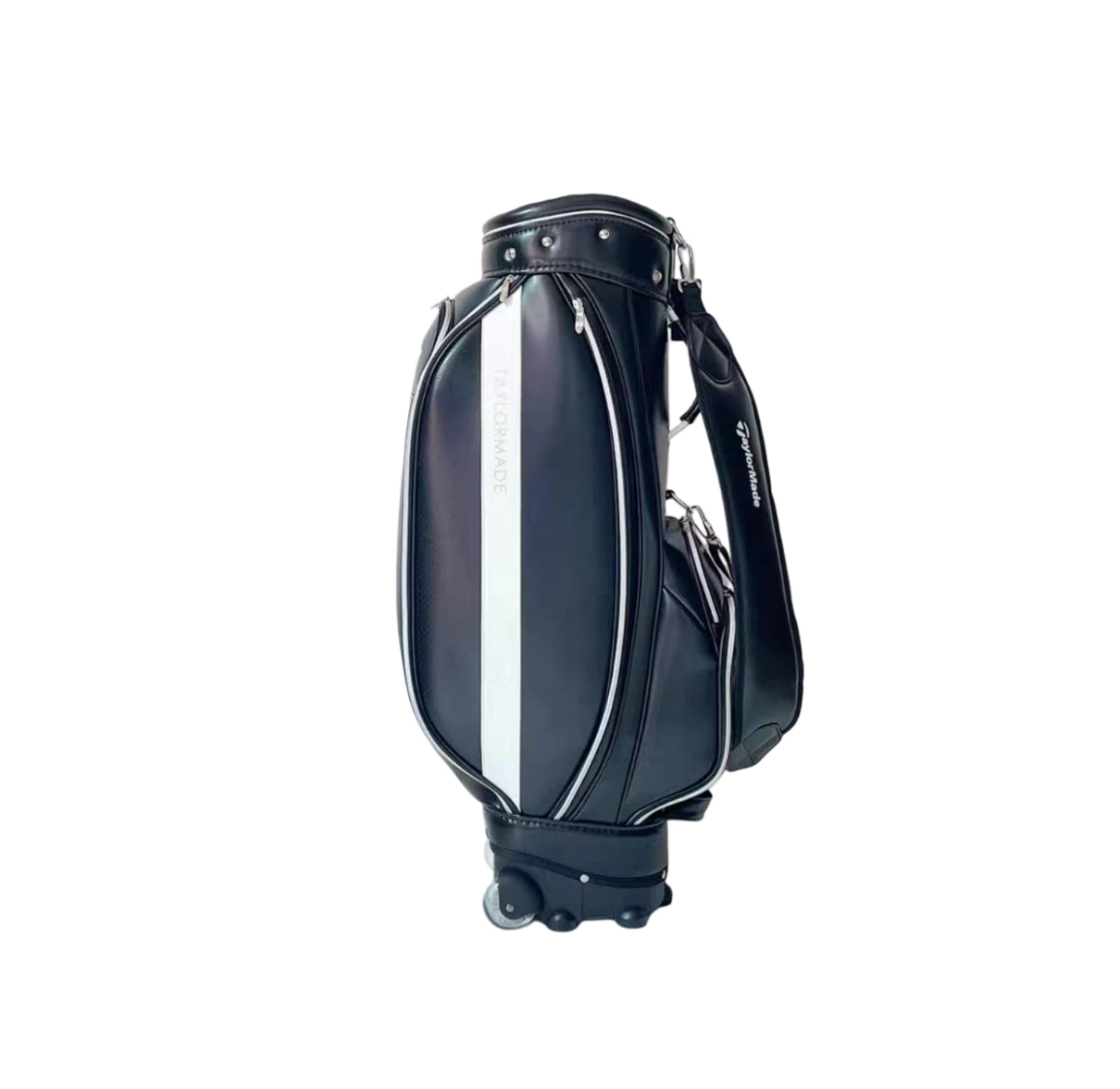 Side view of the TaylorMade wheeled golf caddy bag in black featuring a bold white vertical stripe, dual wheels at the base, and a padded shoulder strap. Designed for easy transport on the course with premium synthetic leather construction and multiple zippered compartments.