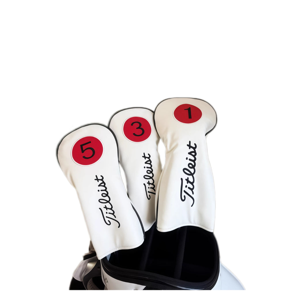 Three white Titleist-style golf headcovers labeled "1", "3", and "5" displayed in a golf bag, featuring red circular number patches and elegant black cursive "Titleist" logo — premium protection for driver, fairway wood, and hybrid clubs.
