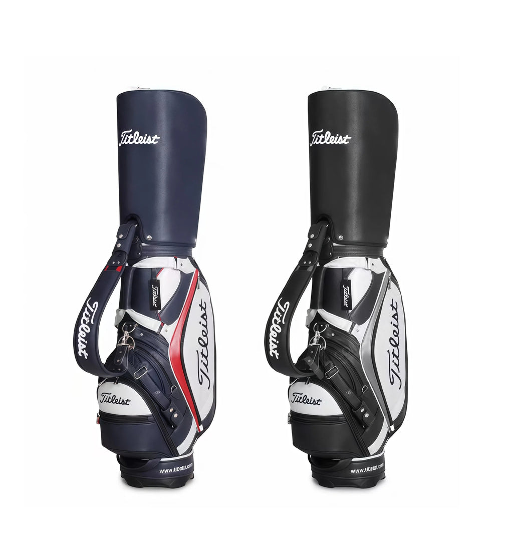 Two Titleist Classic Leather-Look Cart Bags side by side: one in navy blue, white, and red; the other in black, white, and grey. Both feature the iconic "Titleist" script logo, padded shoulder straps, and reinforced base. Perfect for golfers seeking premium style and function.