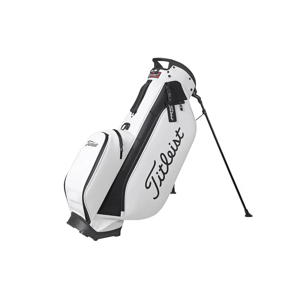 Side profile of the Titleist TB23ASBA stand golf bag in white with black trim. Highlights the durable construction, large "Titleist" script logo, and compact design ideal for both men and women golfers seeking style and function.