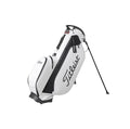 Side profile of the Titleist TB23ASBA stand golf bag in white with black trim. Highlights the durable construction, large "Titleist" script logo, and compact design ideal for both men and women golfers seeking style and function.
