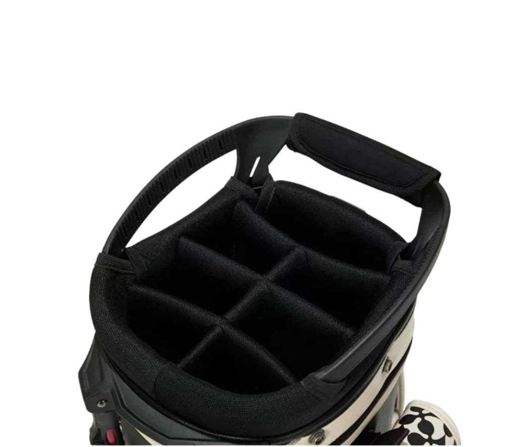 Close-up of Malbon King of Clubs golf bag’s 6-way top divider system, designed to organize clubs securely with padded slots and ergonomic carry handle.