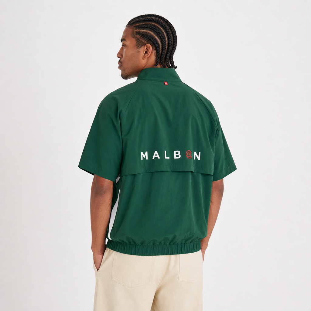 Malbon CLOT Windshirt Green detail and branding close-up